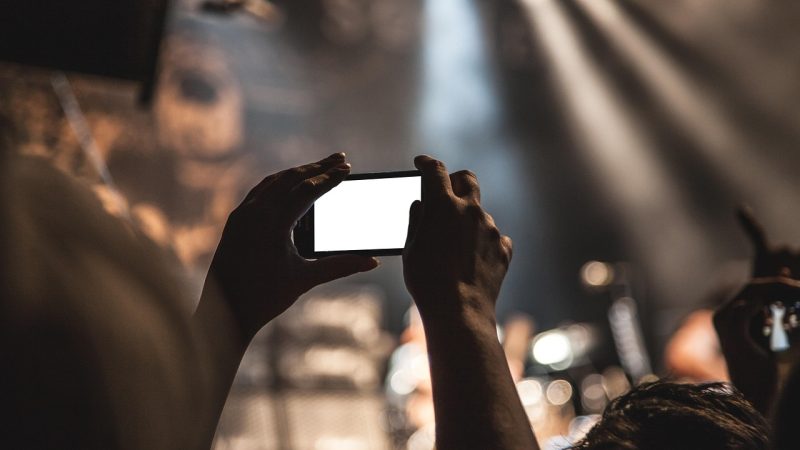 Smartphone, hands, screen — How Toto TV Enhances the Online Betting Experience