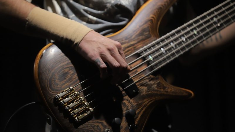 Bass guitar, musical performance, concert — The History of Baccarat: From Europe to the World